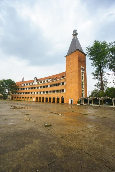 Wall of Teacher College of Dalat after the rain - the architecture that considered as one of the most unique architecture of 1000 's 20th - century at Dalat city, Lam Dong, Vietnam . — стоковое фото