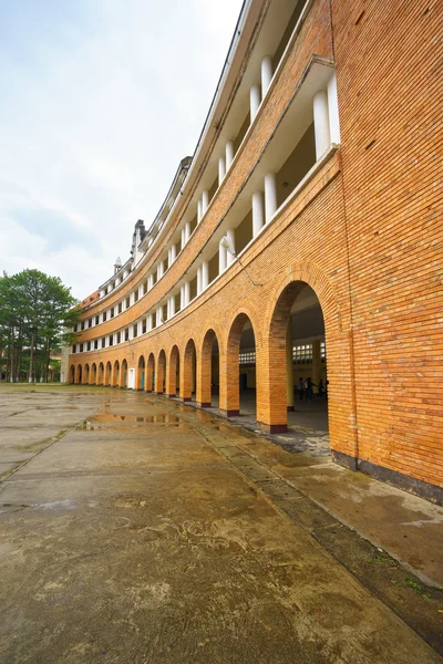 Wall of Teacher College of Dalat after the rain - the architecture that considered as one of the most unique architecture of 1000 's 20th - century at Dalat city, Lam Dong, Vietnam . — стоковое фото