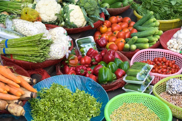Various colorful fresh fruits and vegetables at Ho Chi Minh City local market