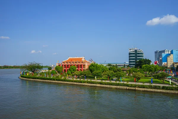 Landscape of Nha Rong port under blue sky on day, statue of Ho chi Minh before commemorative house, Vietnamese flag fly, pot of green tree, Viet Nam — Stock Photo, Image