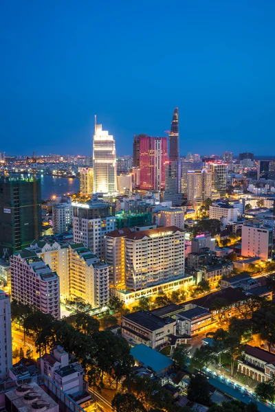 Ho Chi Minh city aeriel view 2015 with new buildings and five star hotels at colorful lights night downtown riverside — Stock Photo, Image