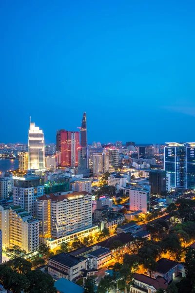 Ho Chi Minh city aeriel view 2015 with new buildings and five star hotels at colorful lights night downtown riverside — Stock Photo, Image