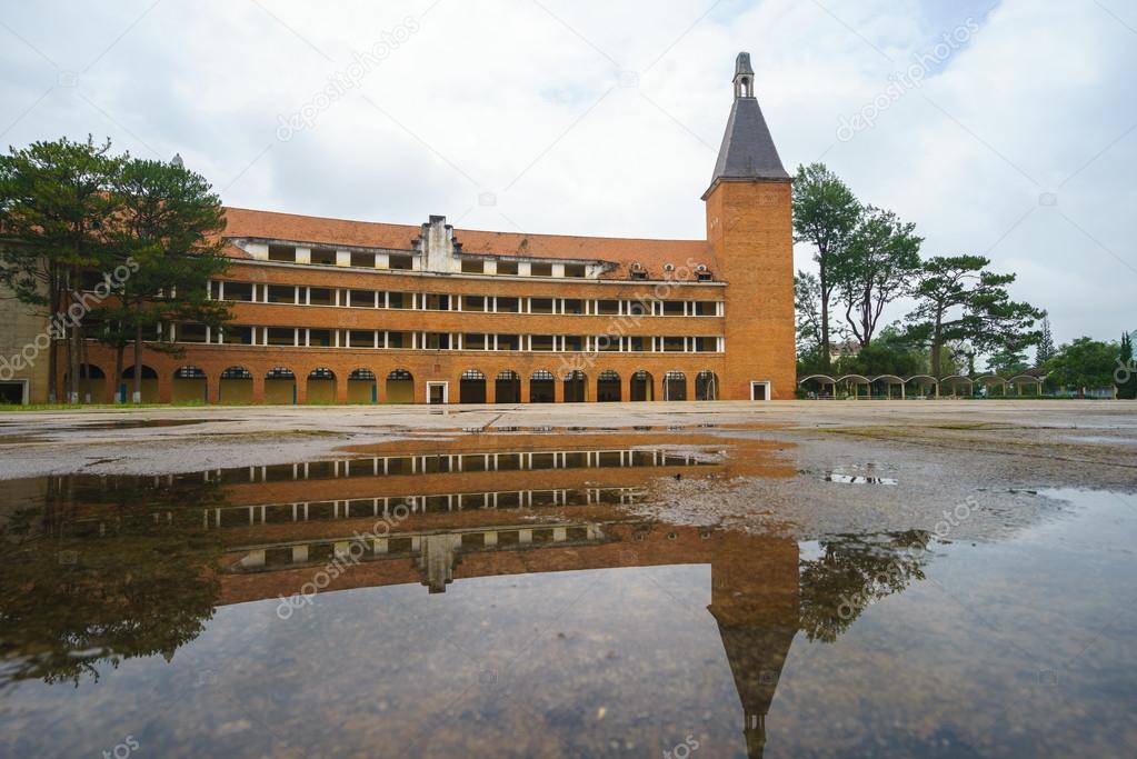 Wall of Teacher College of Dalat after the rain - the architecture that considered as one of the most unique architecture of 1000's 20th - century at Dalat city, Lam Dong, Vietnam.