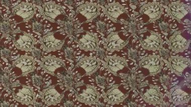 Dikensiz döngü desenli el yapımı retro çiçekli arka plan. Klasik tekstil tasarımından esinlenilmiş klasik süs dokusu, video projeleri, hareket grafikleri, dekoratif arka planlar ve nostaljik görsel hikaye anlatımı için ideal.