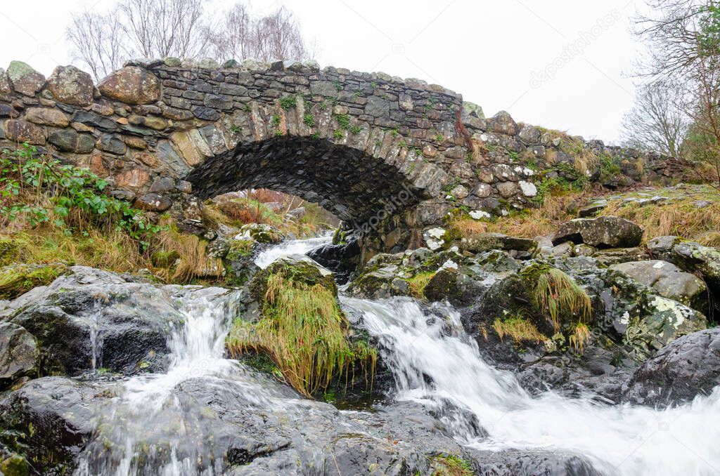 Ashness Stone Bridge over a small river near Keswick Lake District National Park Cumbria England UK