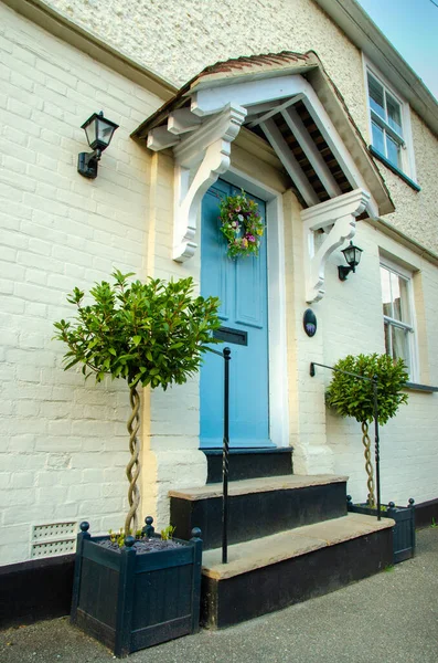 Beautifully Decorated Home Entrance Blue Door Portico Roof Plants Next — Fotografia de Stock