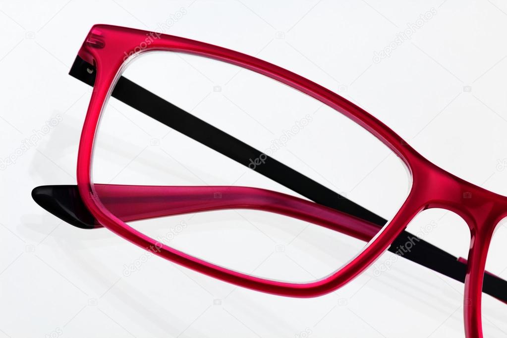Red eyeglass frame close up