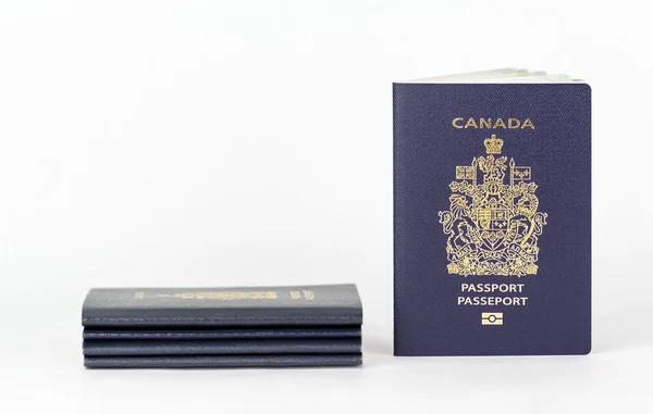New passport with stack of old — Stock Photo, Image