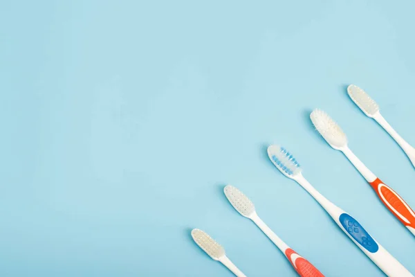 Old Toothbrush Used Expired Damaged Variety Colors Blue Background Concept — Stock Photo, Image