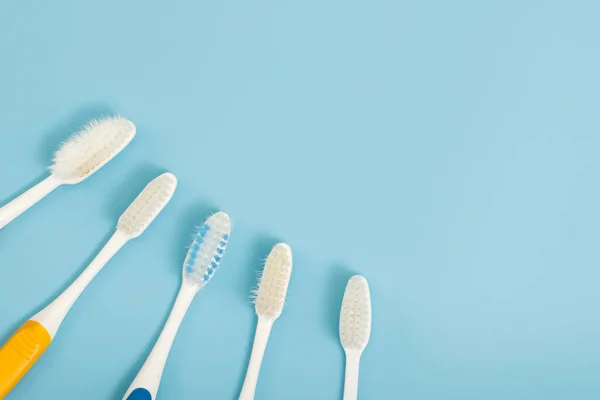 Old Toothbrush Used Expired Damaged Variety Colors Blue Background Concept — Stock Photo, Image