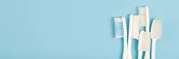 Old Toothbrush Used Expired Damaged Variety Colors Blue Background Concept — Stock Photo, Image