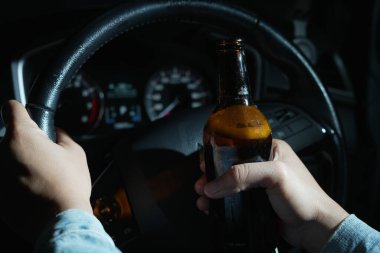 Drinking beer in a car is dangerous for drivers.