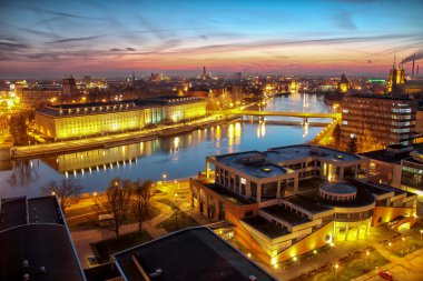 WROCLAW, POLAND - APRIL 02, 2016: Aerial view of Wroclaw. Illuminated city skyline during a beautiful sunset, April 02, 2016 in Wroclaw, Poland.