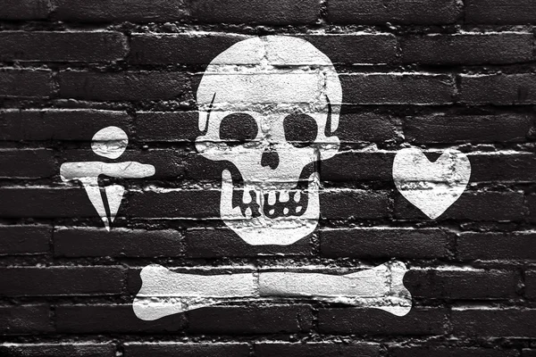 STEDE Bonnet pirat flagga, målade på tegelvägg — Stockfoto