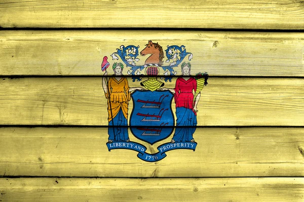 Vlag van New Jersey State, geschilderd op oude houten plank achtergrond — Stockfoto