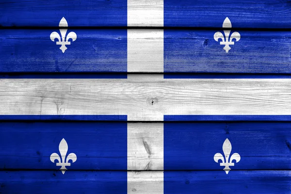 Bandeira de Quebec, pintada sobre fundo velho prancha de madeira — Fotografia de Stock