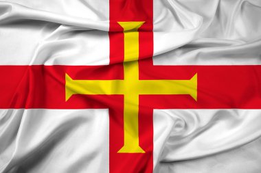 Guernsey bayrağı sallayarak