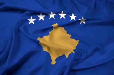 Kosova bayrağı sallayarak