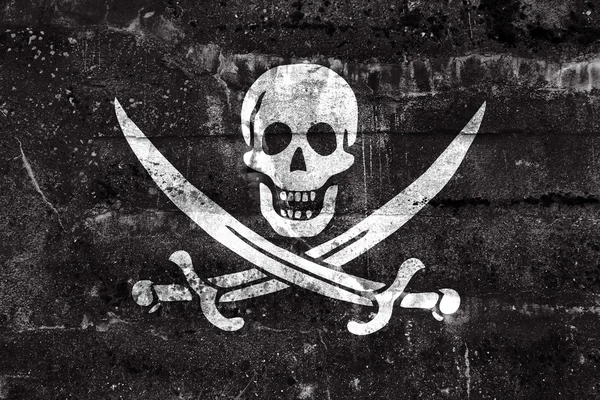 卡利科杰克海盗旗，画在肮脏的墙上。复古和旧外观. — 图库照片
