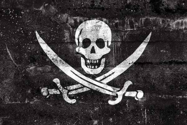 Calico Jack Pirate Flag, painted on dirty wall. Vintage and old look. — Stock Photo, Image