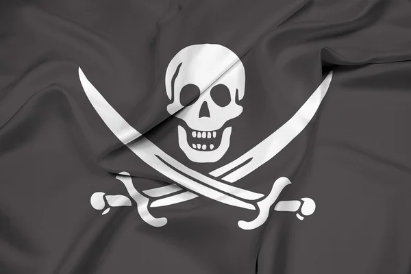 Zwaaien Calico Jack piraat vlag — Stockfoto