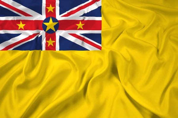 Vlající vlajka niue — Stock fotografie