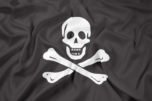 Acenando O tradicional Jolly Roger da pirataria Bandeira — Fotografia de Stock