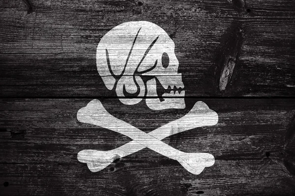 亨利每的海盗旗，涂在旧木板背景 — 图库照片