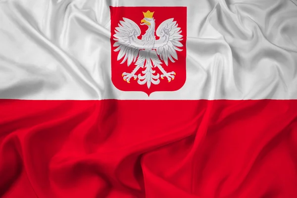 Mávání vlajkou Polska s erbem — Stock fotografie