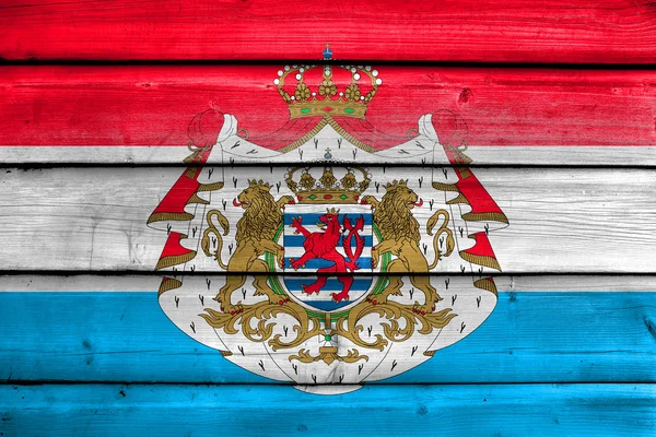 Luxembourgs flag med våbenskjold - Stock-foto