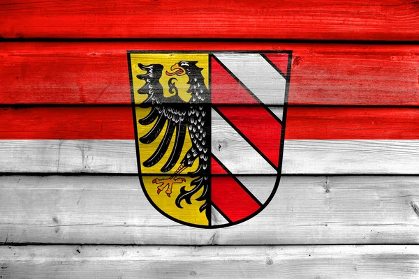 Flag of Nuremberg, Germany, painted on old wood plank background — Stock Photo, Image