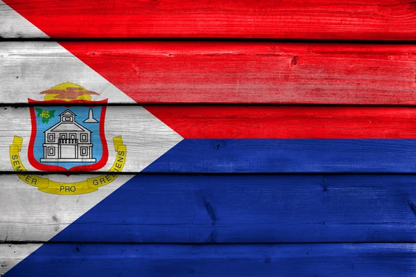 Flag of Sint Maarten, painted on old wood plank background — Stock Photo, Image