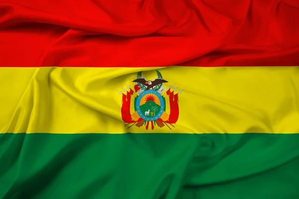 팔의 외 투와 볼리비아의 깃발을 흔들며 — 스톡 사진
