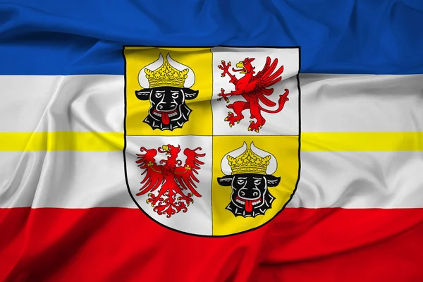 Bandiera sventolante del Meclemburgo-Pomerania occidentale con stemma — Foto Stock