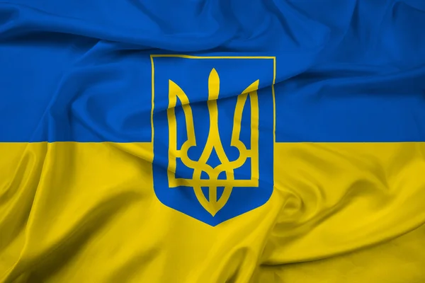 Розмахуючи прапор України з гербом — стокове фото