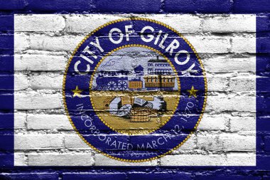 Flag of Gilroy, California, USA, painted on brick wall clipart