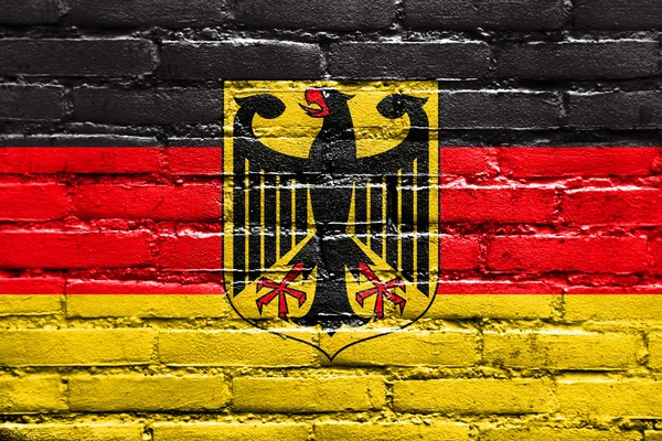 Flag of Germany with Coat of Arms, painted on brick wall — Stock Photo, Image