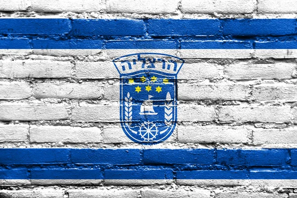 Flaga miasta Herzliya, Izrael, malowane na ceglany mur — Zdjęcie stockowe
