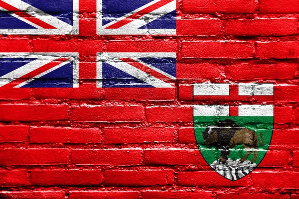 Bandeira da província de Manitoba, Canadá, pintada na parede de tijolos — Fotografia de Stock