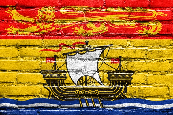 Vlag van de provincie van New Brunswick, Canada, geschilderd op bakstenen muur — Stockfoto