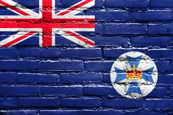 Vlag van de staat Queensland, Australië, geschilderd op bakstenen muur — Stockfoto