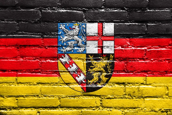 Bandera de Sarre, Alemania, pintada sobre una pared de ladrillo —  Fotos de Stock