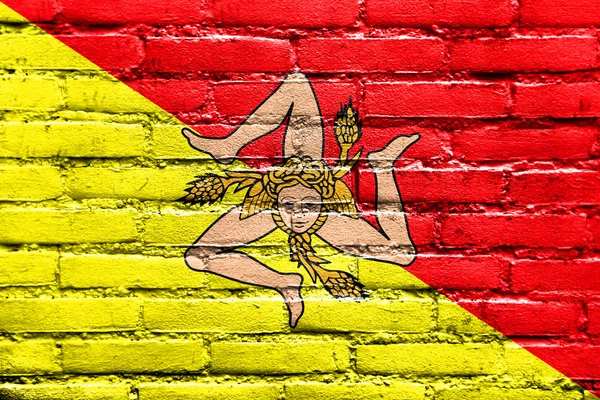 Flag of Sicily Region, Italy, painted on brick wall