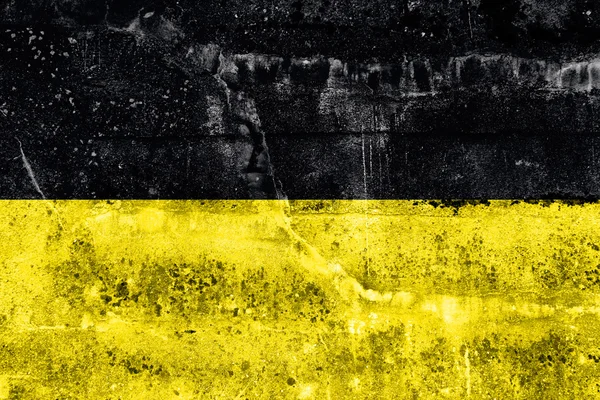 汚れた壁に描かれた、ドイツのバーデン = ヴュルテンベルク州の旗 — ストック写真