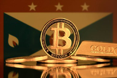 Bitcoin 'in fiziksel versiyonu, altın külçesi ve Grenada Bayrağı.