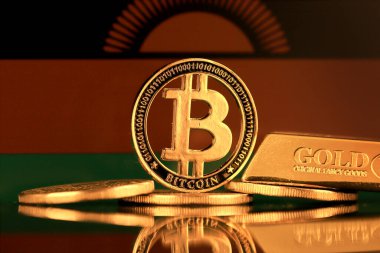 Bitcoin 'in fiziksel versiyonu, altın külçesi ve Malavi Bayrağı.