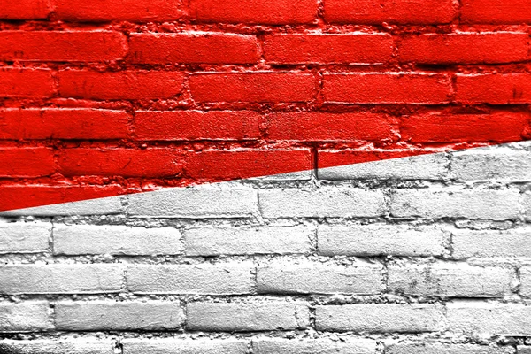Flaga Monako malowane na mur z cegły — Zdjęcie stockowe