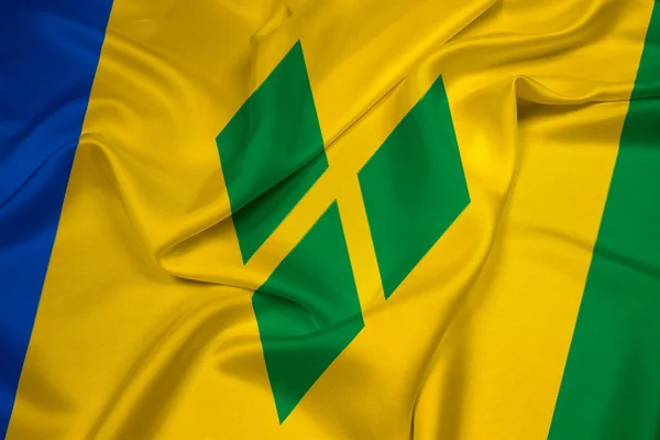 Sankt Vincent und die Grenadinen-Fahne schwenkend — Stockfoto