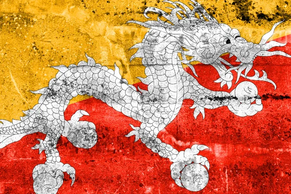 Флаг Бутана раскрашен на гранж-стене — стоковое фото