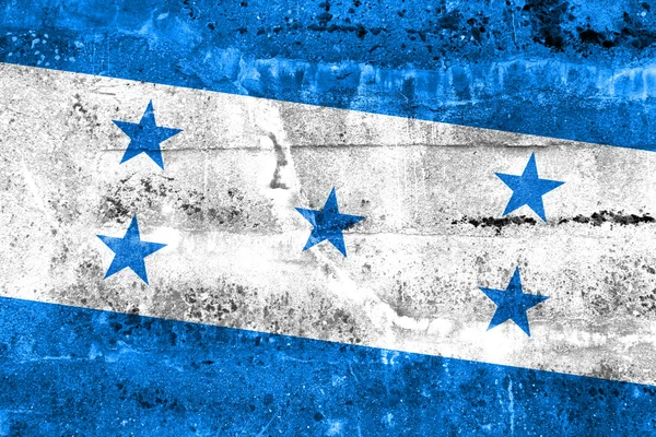 洪都拉斯国旗画在 grunge 的墙上 — 图库照片